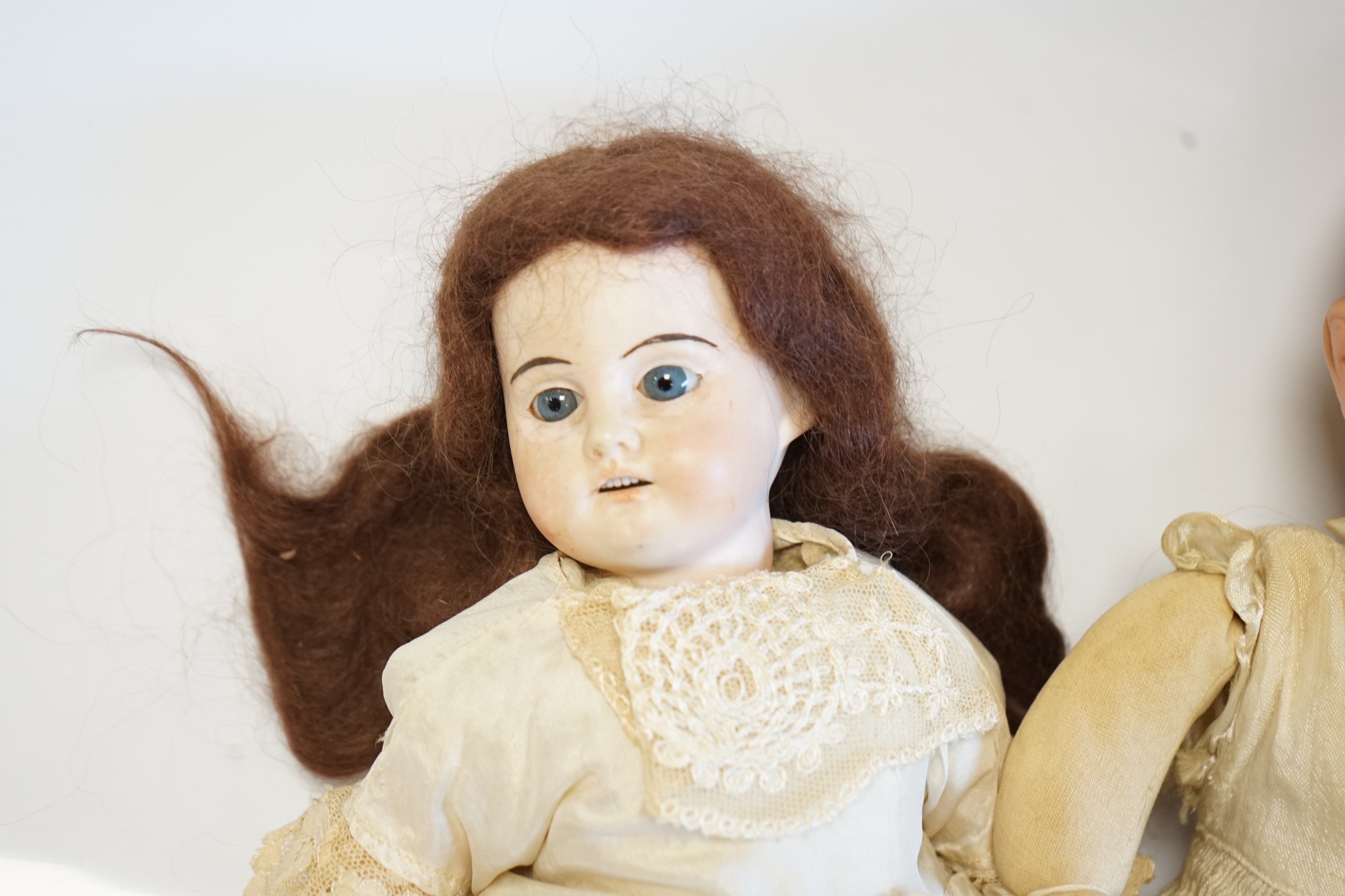 An AM390 doll, 47cm high, an Einco baby doll, 25cm, and a composition baby A.M. soft body modern jointed doll (4). Condition - fair